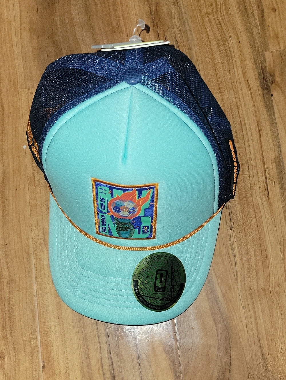Aqua Foam FIFA LIMITED Front Trucker Hat with Navy Mesh & Orange Trim